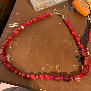 Red necklaces. Great for Christmas.